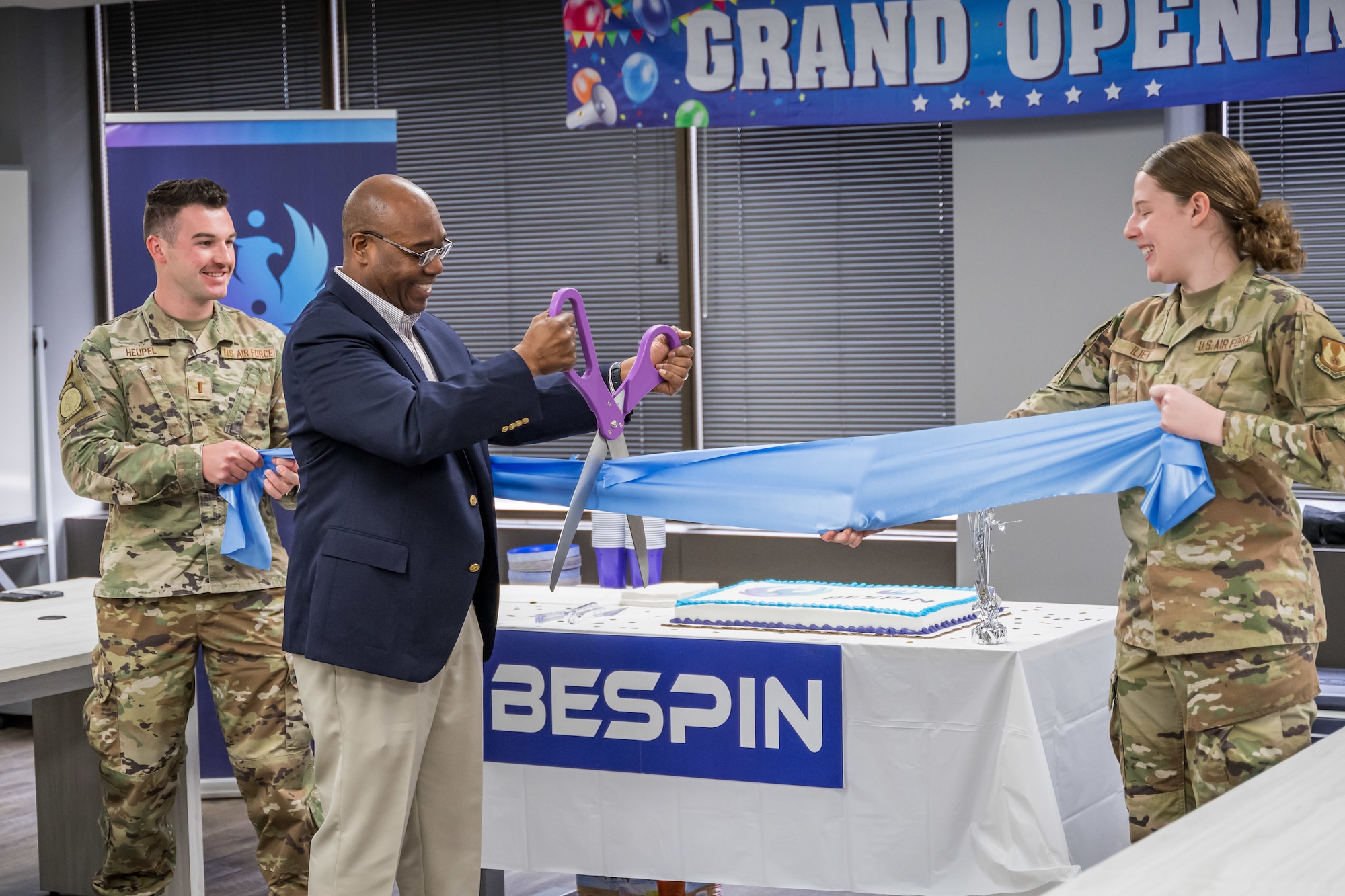 BES Program Executive Officer, Alvin Burse performing the ceremonial ribbon cutting.