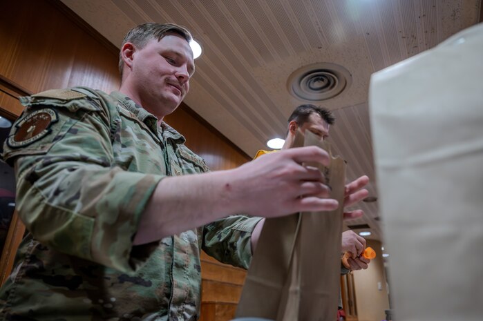 U.S. Air Force Airmen assigned to the 35th Medical Group simulate packing pharmaceutical medicines for the Emergency Evacuation Program (EEP) at Misawa Air Base, Japan, Mar. 11, 2025.