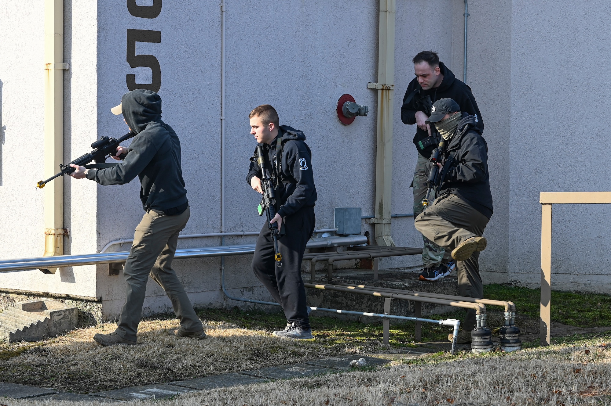 Airmen assigned to the 8th Security Forces Squadron act as an opposing force strike team to ambush 8th SFS Defenders to test their ability to quickly counter base threats during Freedom Shield 25.