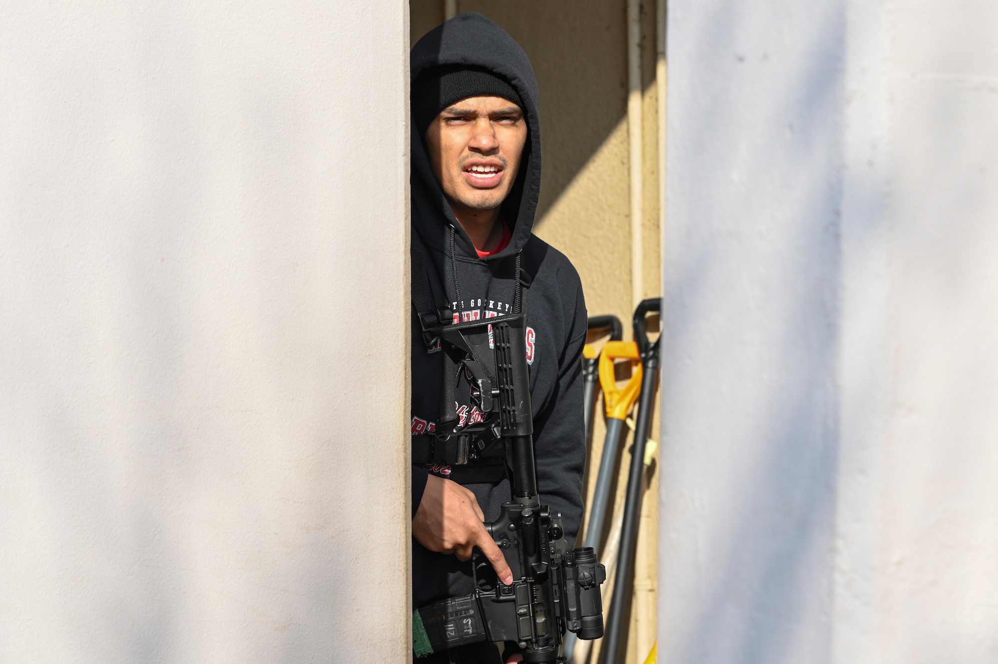 U.S. Air Force Staff Sgt. Antonio Carrion, 8th Security Forces Squadron opposing force strike team member, prepares to ambush 8th SFS defenders in a simulated ground attack training during Freedom Shield 25.