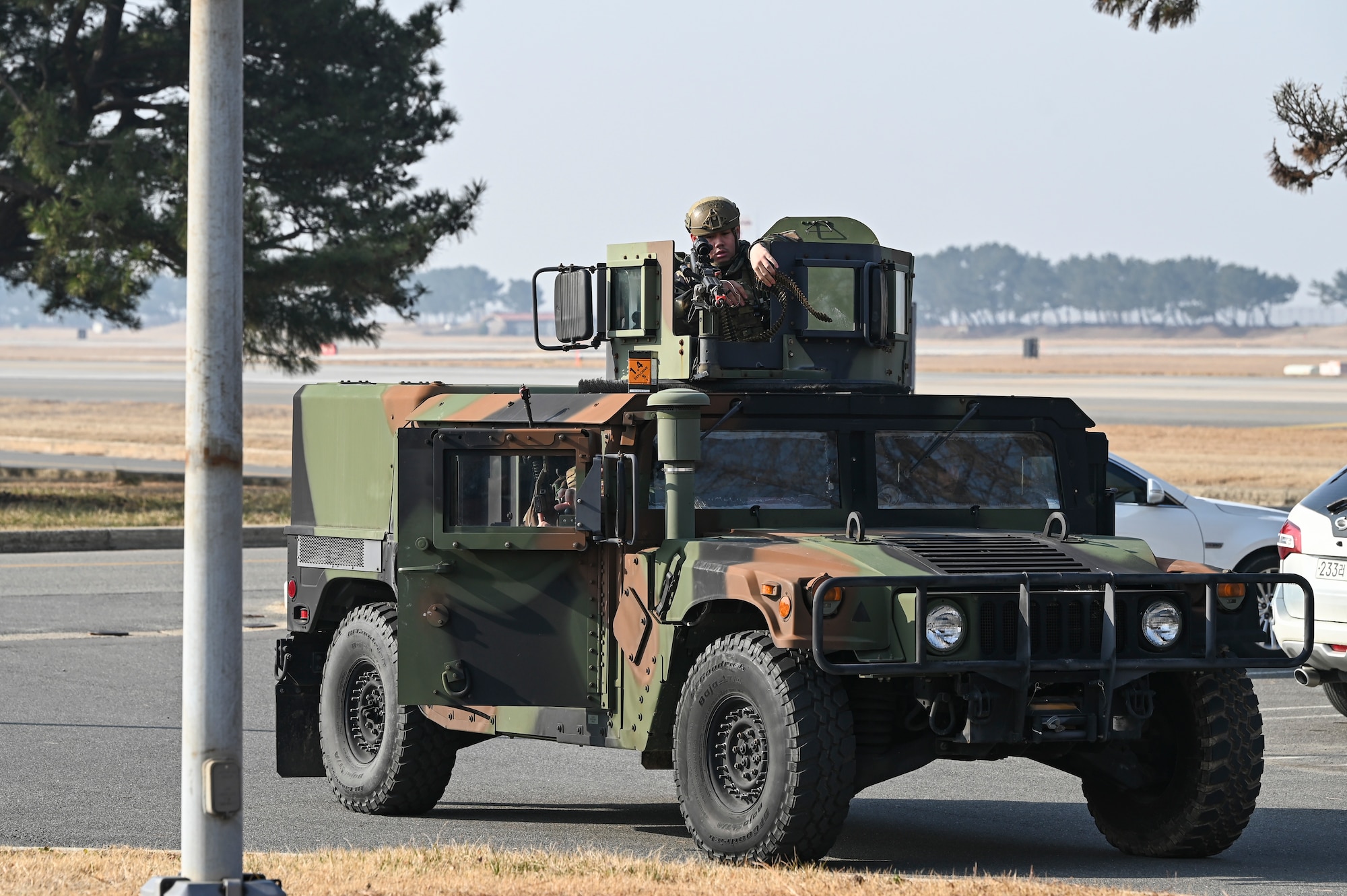 Senior Airman Nathan Barbaza, 8th Security Forces Squadron response force leader, loads his weapon in response to a simulated ground attack training during Freedom Shield 25.