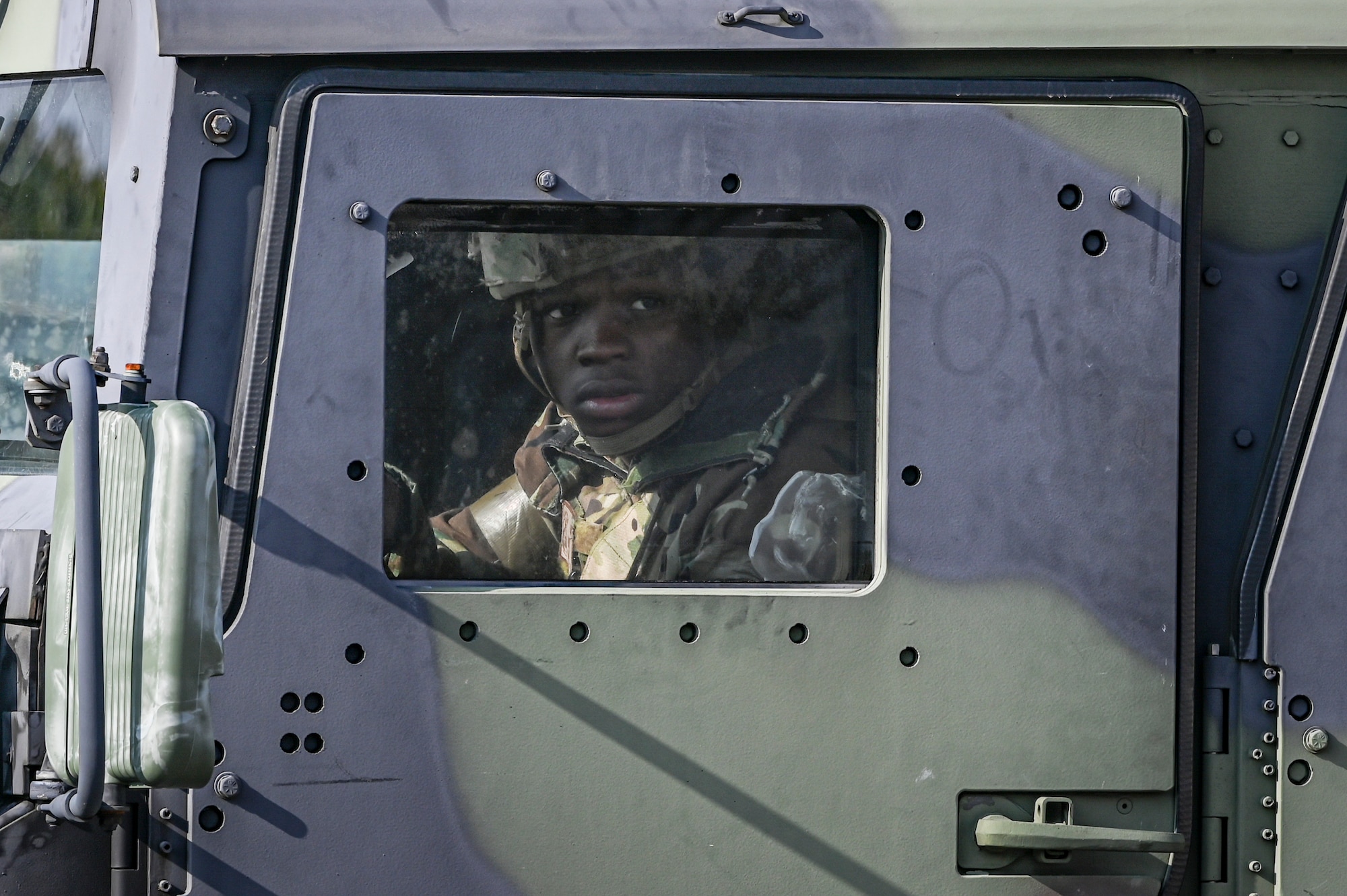 U.S. Air Force Airman Zion Mosley, 8th Security Forces Squadron member, looks for opposing forces while responding to a simulated ground attack during Freedom Shield 25.