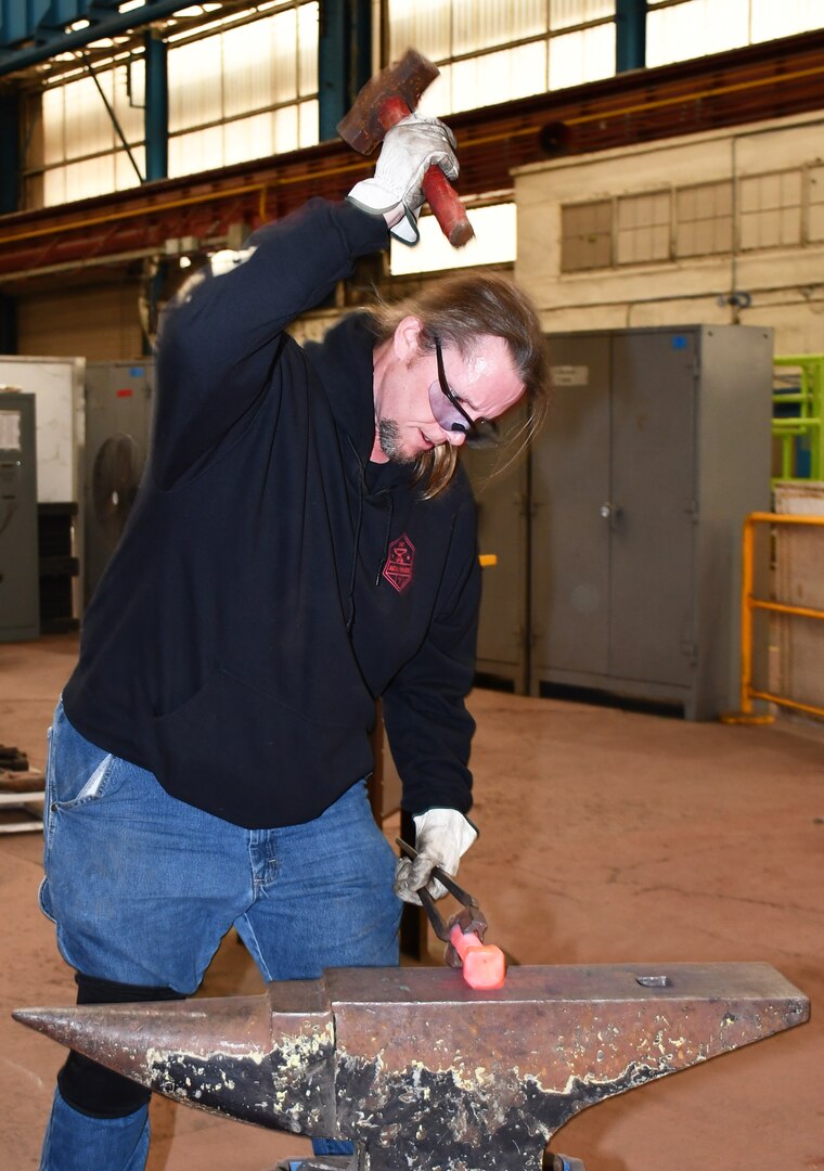 Norfolk Naval Shipyard Metal Forging Shop (Shop 11F) Metal Forger Work Leader Eric Slate enjoys making tools for other shops in order to make their job easier and provide better quality. “We actually have a lot of shops in the vicinity where the mechanics come to us needing a center punch, a pry and other materials and tools they use every day,’ said Slate. “Knowing that Shop 11F can help other shops and codes to perform their job gives me a sense of pride on what I love to do.”