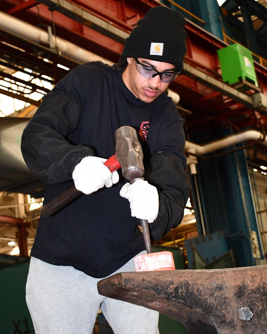 Norfolk Naval Shipyard Metal Forging Shop (Shop 11F) Metal Forger Apprentice Sam Graves has been at NNSY for six months. Graves became an apprentice, looking for a steady job where he could learn a new skill. “Currently I am doing a lot of shadowing, watching how the shop does its job and how to do it safe,” said Graves. “I’m looking forward to get into the grind of things to start learning by doing.”
