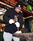 Norfolk Naval Shipyard Metal Forging Shop (Shop 11F) Metal Forger Apprentice Sam Graves has been at NNSY for six months. Graves became an apprentice, looking for a steady job where he could learn a new skill. “Currently I am doing a lot of shadowing, watching how the shop does its job and how to do it safe,” said Graves. “I’m looking forward to get into the grind of things to start learning by doing.”