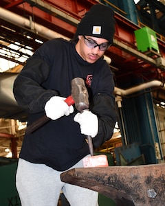 Norfolk Naval Shipyard Metal Forging Shop (Shop 11F) Metal Forger Apprentice Sam Graves has been at NNSY for six months. Graves became an apprentice, looking for a steady job where he could learn a new skill. “Currently I am doing a lot of shadowing, watching how the shop does its job and how to do it safe,” said Graves. “I’m looking forward to get into the grind of things to start learning by doing.”