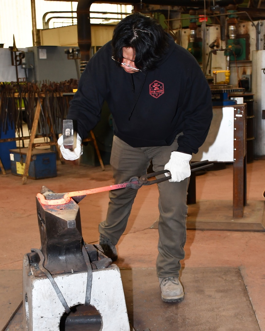 Norfolk Naval Shipyard Metal Forging Shop (Shop 11F) Metal Forger Apprentice Andrew “A.J.” Cruz has been an apprentice for approximately six months. “The idea of going to college and earning a degree didn’t feel right for me,” said Cruz. “I felt coming here and learning a trade and the opportunity to work with my hands was the best decision for me at the time and currently, I have no regrets.”