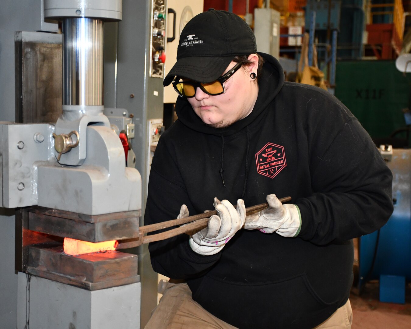 Norfolk Naval Shipyard Metal Forging Shop (Shop 11F) Metal Forger Alejandro “Alex” Beason became interested in blacksmithing when he was about 13-years-old. “A family friend needed a place to store her forge anvil and all the equipment she had,” said Beason. “Once she brought it over and I got a hammer and a pair of tongs in my hand and actually got to start working with pieces of material, I knew I was hooked and stayed with it ever since.”