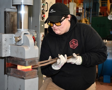 Norfolk Naval Shipyard Metal Forging Shop (Shop 11F) Metal Forger Alejandro “Alex” Beason became interested in blacksmithing when he was about 13-years-old. “A family friend needed a place to store her forge anvil and all the equipment she had,” said Beason. “Once she brought it over and I got a hammer and a pair of tongs in my hand and actually got to start working with pieces of material, I knew I was hooked and stayed with it ever since.”