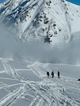 A 210th Rescue Squadron HH-60G Pave Hawk with 212th Rescue Squadron pararescuemen onboard searches for an injured paraglider March 8, 2025, at Hatcher Pass. The rescuers found, treated and transported the patient to Providence Alaska Medical Center in Anchorage.