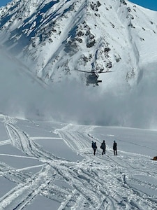 A 210th Rescue Squadron HH-60G Pave Hawk with 212th Rescue Squadron pararescuemen onboard searches for an injured paraglider March 8, 2025, at Hatcher Pass. The rescuers found, treated and transported the patient to Providence Alaska Medical Center in Anchorage.