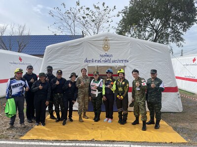 Lt. Col. Khadidja Harrell, flight surgeon with 194th Medical Group, Washington Air National Guard, poses with other medics during the disaster relief and humanitarian assistance exercise Cobra Gold 2025 Feb. 26 – 27 in Chachoengsao Province, Thailand.