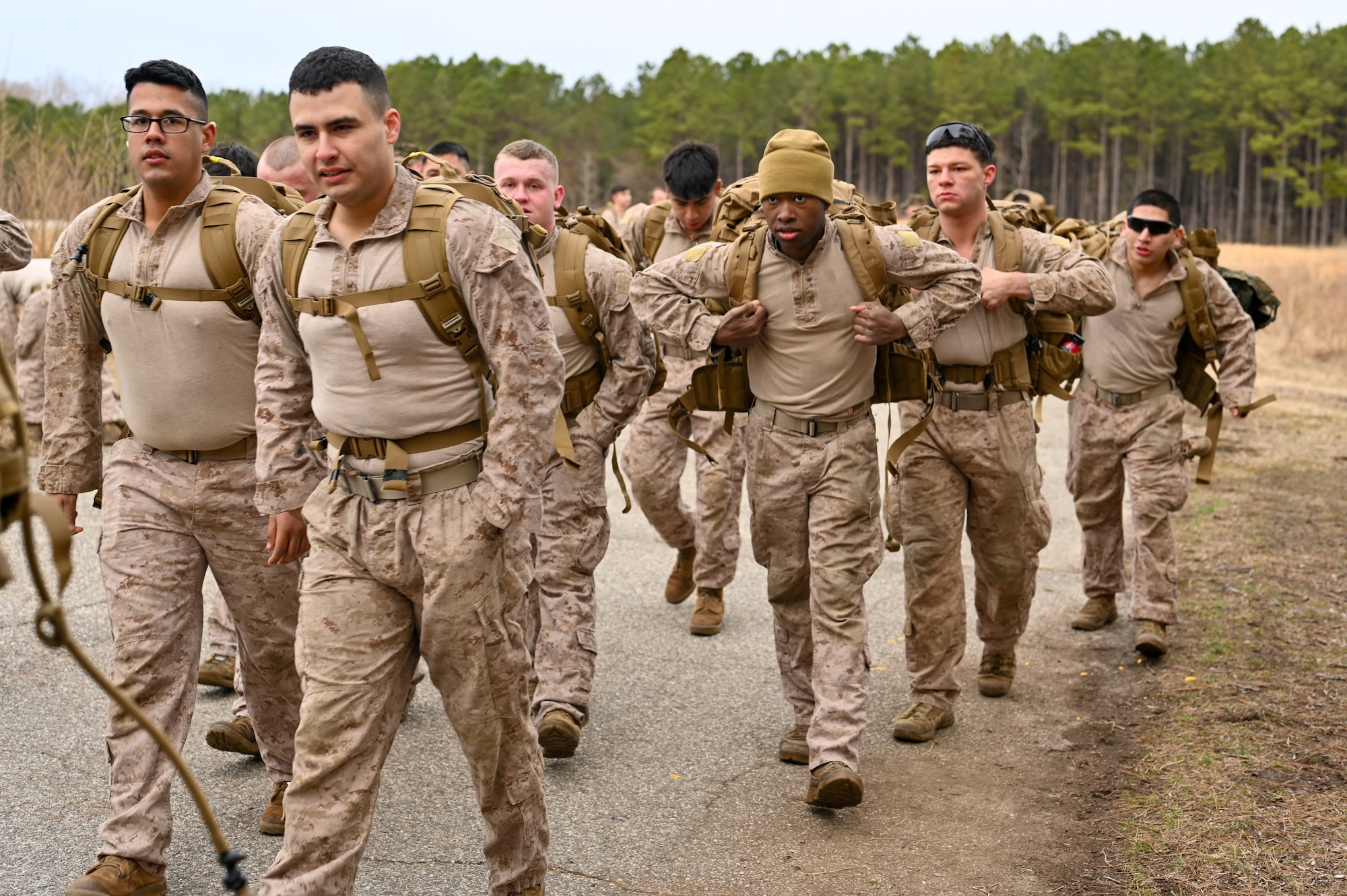 A group of fresh looking Marines begin to move to the start line of the Norwegian Foot March.