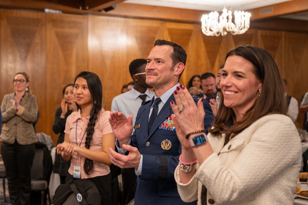 U.S. Air Force Maj. Gen. Paul D. Moga, Third Air Force commander, and distinguished guests, provide a standing ovation during the 2025 European Military Youth of the Year ceremony at Ramstein Air Base, Germany, March 10, 2025. Ramstein Air Base participated in the Youth of the Year program to recognize youth and celebrate the nation’s most inspiring teens and their stories of leadership and excellence.