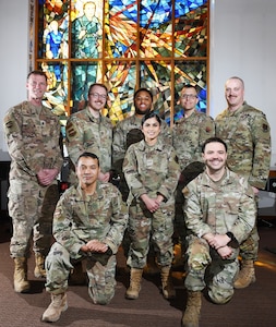 Airmen pose for a photo inside the SAC Chapel.