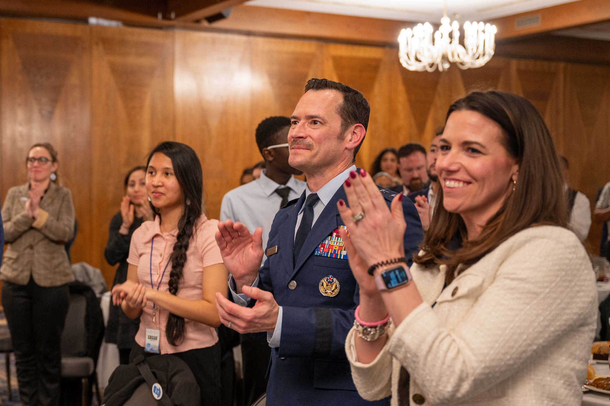 U.S. Air Force Maj. Gen. Paul D. Moga, Third Air Force commander, and distinguished guests, provide a standing ovation during the 2025 European Military Youth of the Year ceremony at Ramstein Air Base, Germany, March 10, 2025. Ramstein Air Base participated in the Youth of the Year program to recognize youth and celebrate the nation’s most inspiring teens and their stories of leadership and excellence.