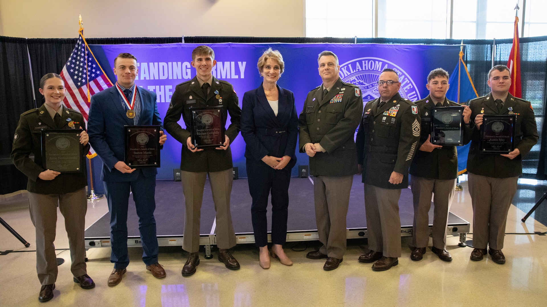 Four Southwestern Oklahoma State University Guard Officer Leadership Program Development officer candidates and Statton Mantz, a student lifeguard at SWOSU, pose for a photo with SWOSU President, Dr. Diana Lovell, Maj. Gen. Thomas H. Mancino, adjutant general for Oklahoma, and Command Sgt. Maj. John Hernandez, the state command sergeant major for Oklahoma, Wednesday, March 12, 2025, in Weatherford, Oklahoma. The five students were presented with awards for saving the life of a GOLD officer candidate during training. (Oklahoma National Guard photo by Sgt. Tyler Brahic)