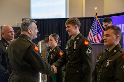 Maj. Gen. Thomas H. Mancino, the adjutant general for Oklahoma, presents Pfc. Rhyson Golightly, an officer candidate with the Southwestern Oklahoma State University Guard Officer Leadership Development program, with the Army Achievement Medal for his heroic actions in saving a fellow GOLD officer candidate’s life during a training exercise, Wednesday, March 12, 2025, in Weatherford, Oklahoma. The actions of Golightly exemplify the values of Citizen-Soldiers and the Oklahoma National Guard, highlighting their valor, readiness and selfless community service. (Oklahoma National Guard photo by Sgt. Tyler Brahic)