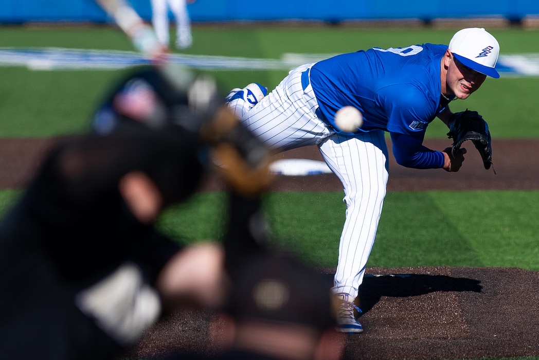 Baseball pitcher throwing a baseball