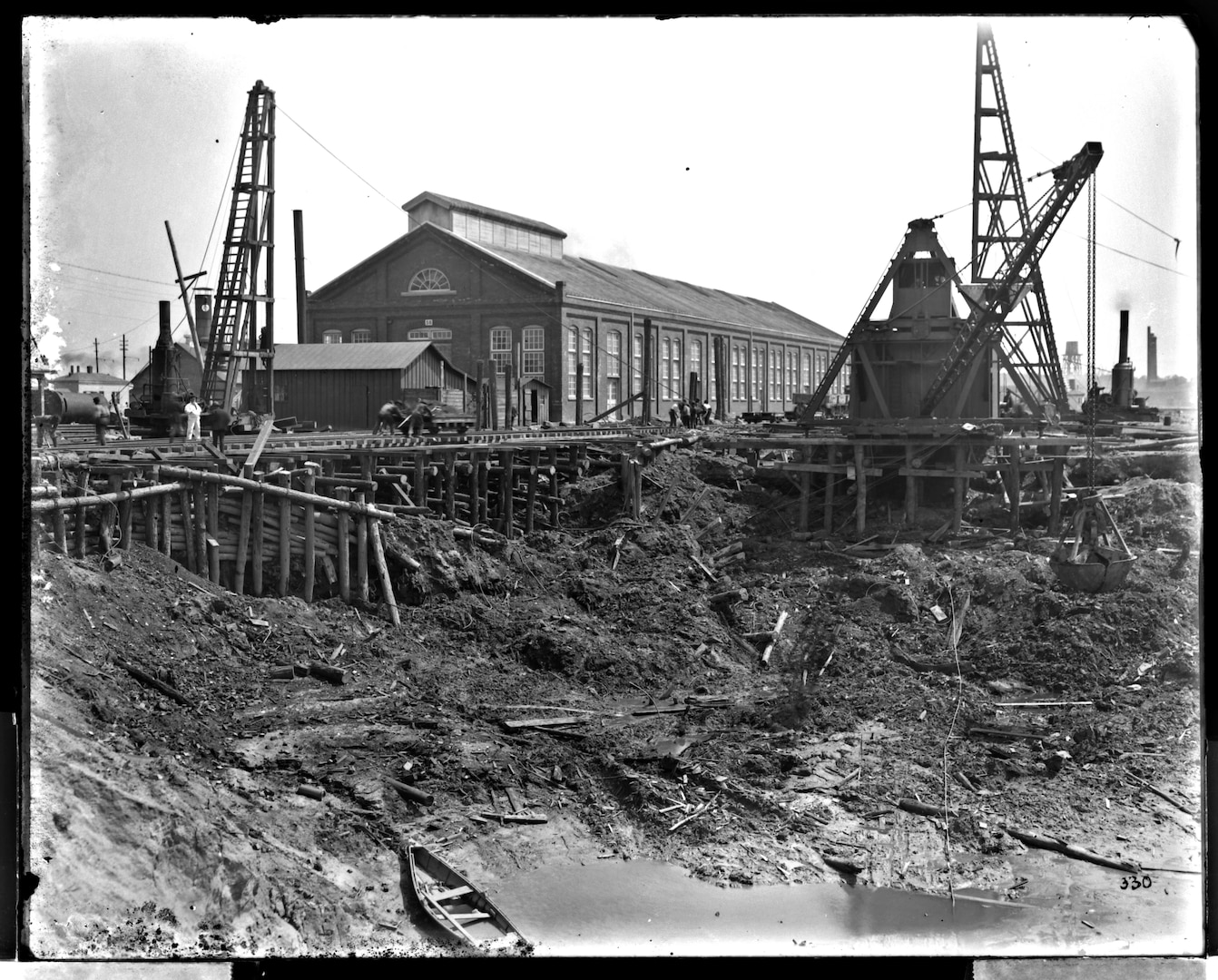 This photograph from April 11, 1904 showcases the steam excavator continuing to dig the basin for Dry Dock 3 while supported by a structure of pilings.
