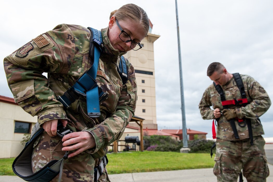Airmen don harnesses for confined space safety training