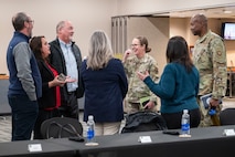 U.S. Air Force Maj. Gen. Stacy Jo Huser, the 20th Air Force Commander, and Chief Master Sgt. Nicholas Taylor, the 20th Air Force Command Chief Master Sergeant, greet civic leaders at the Jimmy Doolittle Center on Minot Air Force Base, North Dakota, March 11, 2025. Huser and Taylor had a group lunch with 91st Missile Wing leadership and personnel to discuss Team Minot’s mission. (U.S. Air Force photo by Senior Airman Kendra A. Ransum)