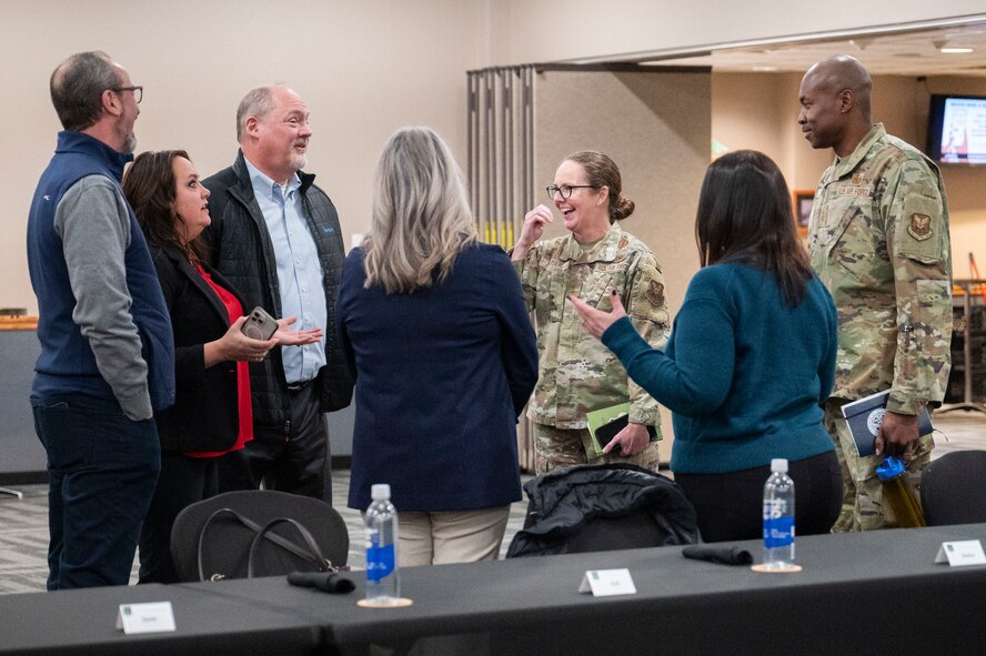 U.S. Air Force Maj. Gen. Stacy Jo Huser, the 20th Air Force Commander, and Chief Master Sgt. Nicholas Taylor, the 20th Air Force Command Chief Master Sergeant, greet civic leaders at the Jimmy Doolittle Center on Minot Air Force Base, North Dakota, March 11, 2025. Huser and Taylor had a group lunch with 91st Missile Wing leadership and personnel to discuss Team Minot’s mission. (U.S. Air Force photo by Senior Airman Kendra A. Ransum)