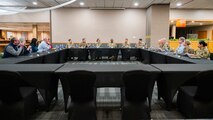 U.S. Air Force personnel from the 20th Air Force, 91st Missile Wing and local civic leaders talk during a group lunch at the Jimmy Doolittle Center on Minot Air Force Base, North Dakota, March 11, 2025. U.S. Air Force Maj. Gen. Stacy Jo Huser, the 20th Air Force Commander, and Chief Master Sgt. Nicholas Taylor, the 20th Air Force Command Chief Master Sergeant, visited many base facilities to observe the mission of Team Minot. (U.S. Air Force photo by Senior Airman Kendra A. Ransum)
