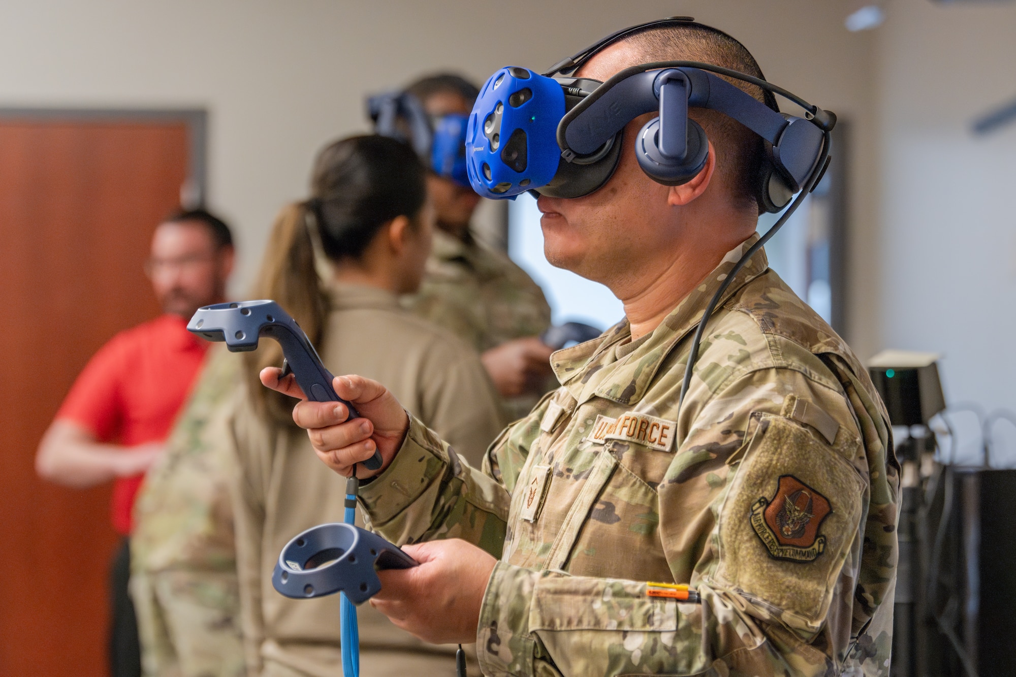 An Airman  utilizes a virtual reality headset to practice aircraft maintenance