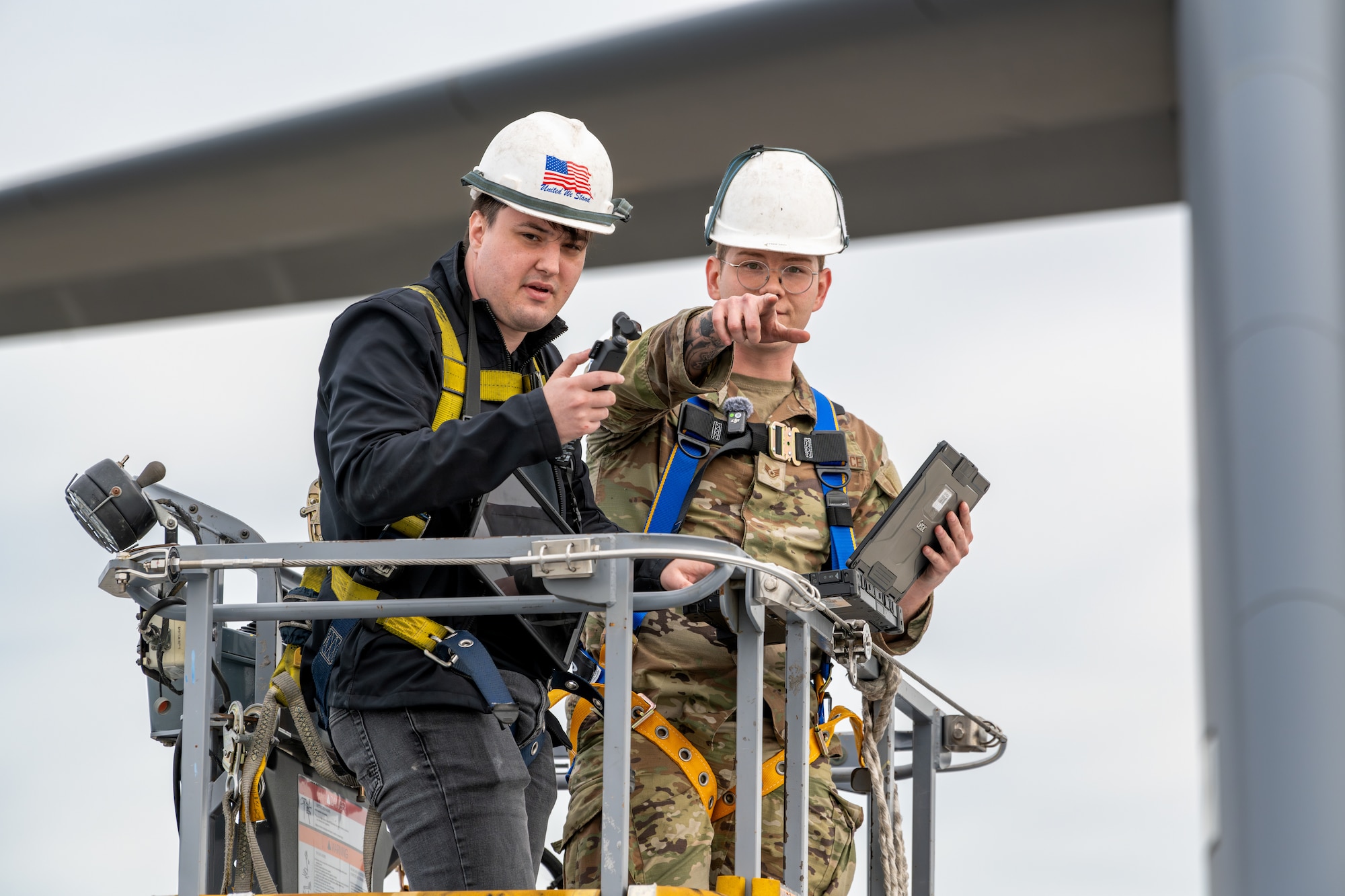 An Airman points out antenna radiation zones on a C-17 Globemaster III