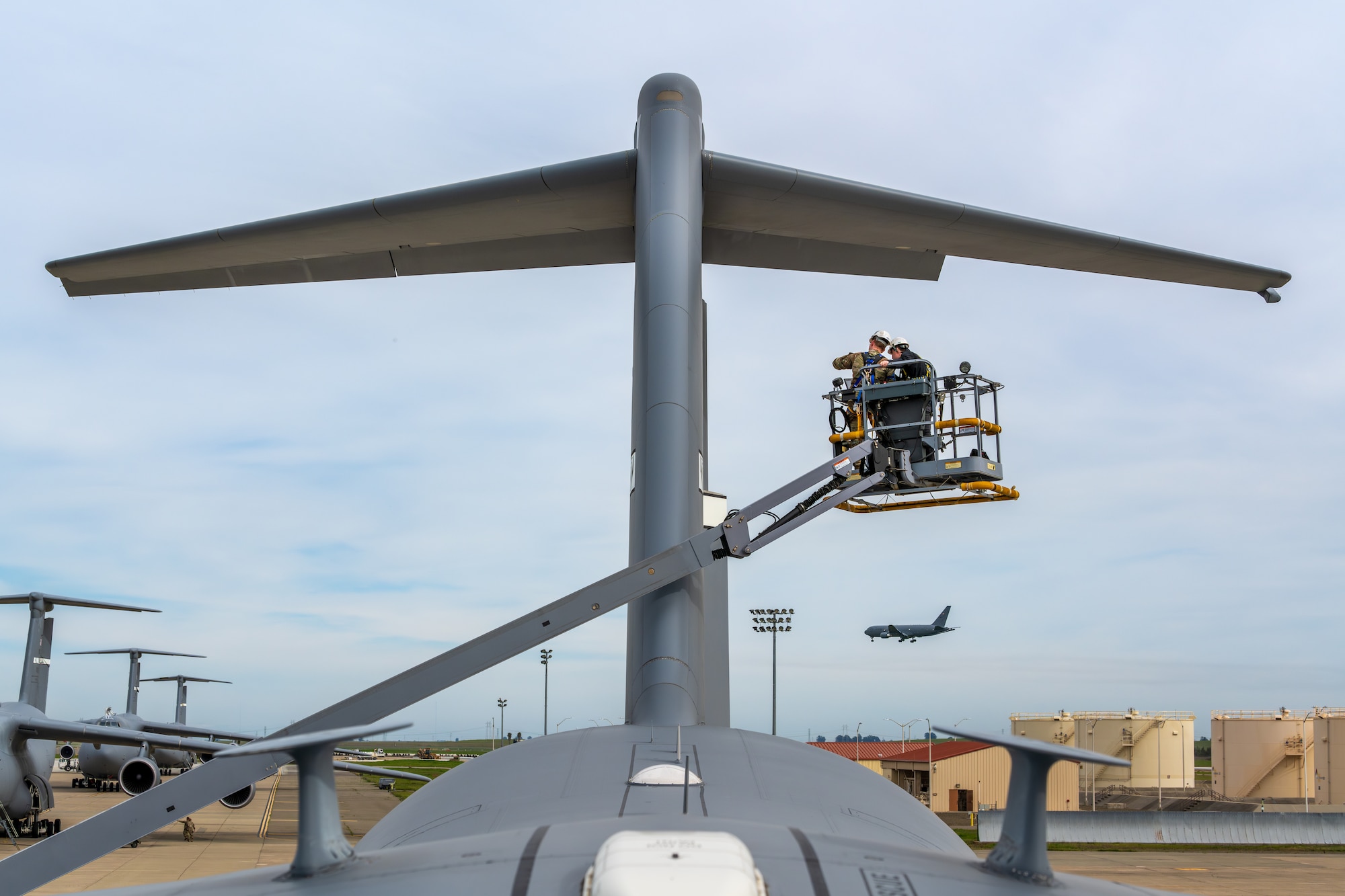 An Airman points out antenna radiation zones on a C-17 Globemaster III