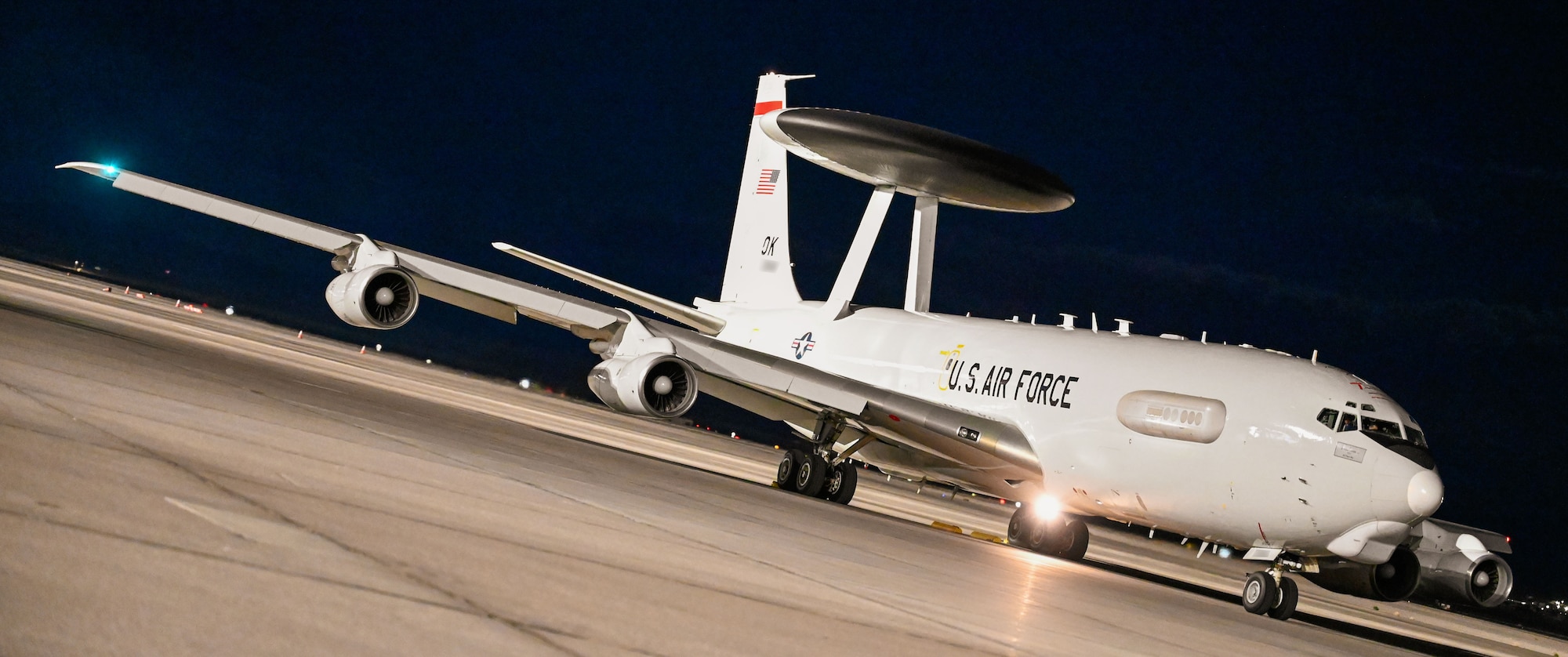 A U.S. Air Force E-3 Sentry Airborne Warning and Control System (AWACS) aircraft prepares for departure at Nellis Air Force Base, Nevada, during Red Flag 25-2. The AWACS provides real-time battle management, surveillance, and command and control, enhancing situational awareness for allied forces.

(U.S. Air Force photo by Garrett N. Cole)