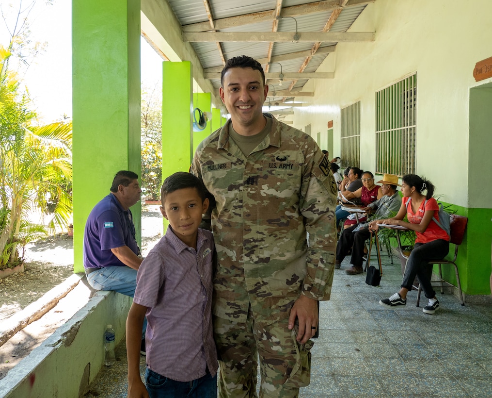 U.S. Army Capt. Ace Mulliner, Deputy Command Surgeon for JTF-Bravo, poses with a young patient during a medical mission in La Paz, Honduras, March 12, 2025. These medical missions have become a hallmark of JTF-Bravo's enduring legacy in the region, demonstrating their unwavering dedication to building a stronger and more resilient Honduras and Central America. (U.S. Army courtesy photo)