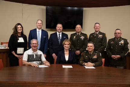 (front row, left to right) Mayor Mike Brown, mayor of Weatherford, Oklahoma, Dr. Diana Lovell, Southwestern Oklahoma State University president, and Maj. Gen. Thomas H. Mancino, adjutant general for Oklahoma, gather after signing agreements at Weatherford city hall in Weatherford, Oklahoma, March 12, 2025. The ceremony celebrated the signing of agreements, fostering cooperation between the city, university and the Oklahoma National Guard. (Oklahoma National Guard photo by Sgt. Tyler Brahic)