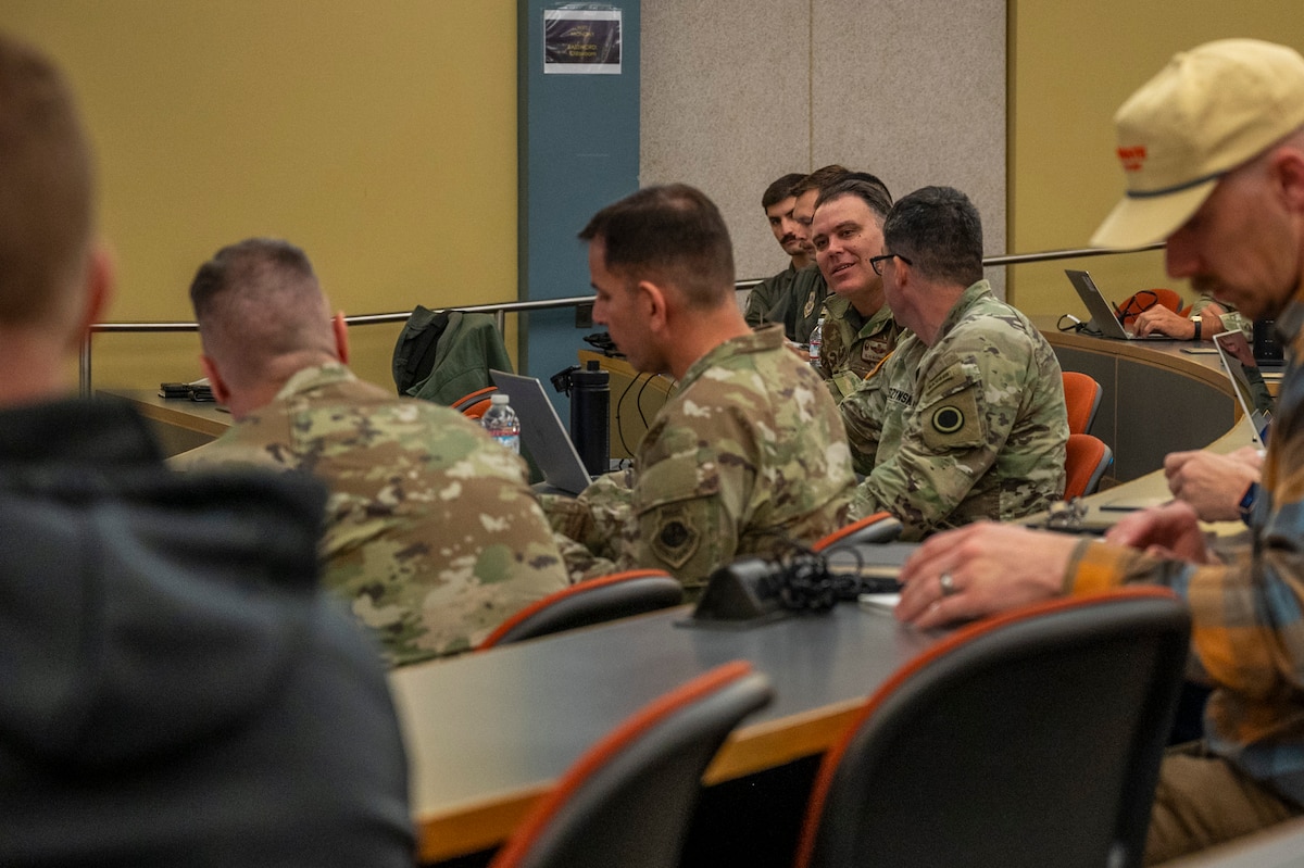 U.S. Air Force Col. Patrick McClintock, 62d Operations Group commander, responds to U.S. Army Brig. Gen. Bernard Harrington, I Corps deputy commanding general, during the final briefing of the second iteration of the Joint Exercise Training Working Group-West conference at Joint Base Lewis-McChord, Washington, March 12, 2025.