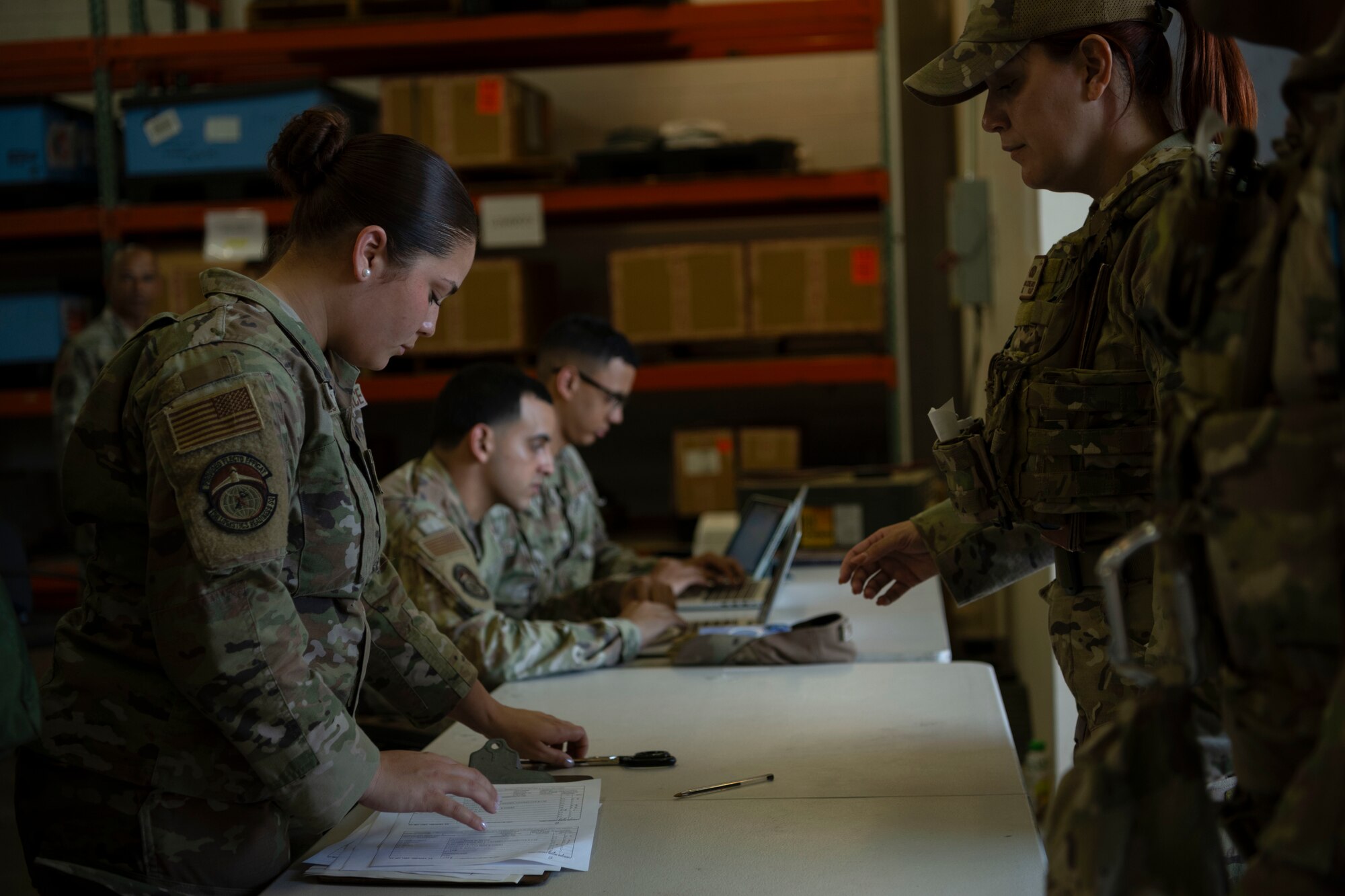 U.S. Air Force Senior Airman Barbara Ortiz, a material management journeyman with the 156th Logistics Readiness Squadron, Puerto Rico Air National Guard, registers Airmen with the 156th Contingency Response Group, PRANG,  the for tactical gear issue during Mothball 2 Combat Readiness Exercise at Muñiz Air National Guard Base, Carolina, Puerto Rico, March 7, 2025. Mothball 2 measured  the 156th Wing’s ability to generate, employ and sustain contingency response capabilities in a full war-fighting scenario, increasing readiness and force lethality. (U.S. Air National Guard photo by Senior Airman Victoria Jewett)