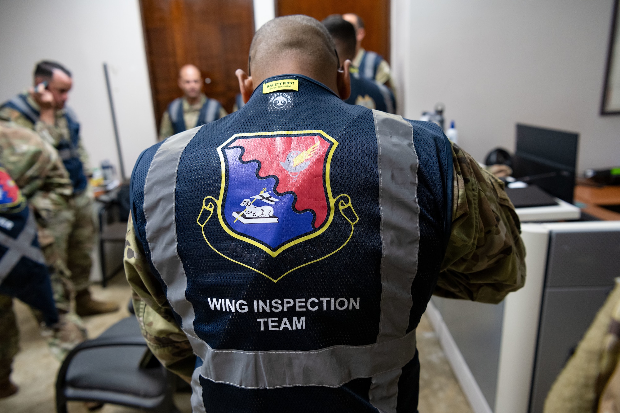 A detailed shot of the 156th Wing Inspection Team vest during their brief meeting for Mothball 2 Combat Readiness Exercise  at Muñiz Air National Guard Base, Carolina, Puerto Rico, March 9, 2025. Mothball 2 measured the 156th Wing’s ability to generate, employ and sustain contingency response capabilities in a full war-fighting scenario, increasing readiness and force lethality. (U.S. Air National Guard photo by Senior Airman Nilsa Mendez)