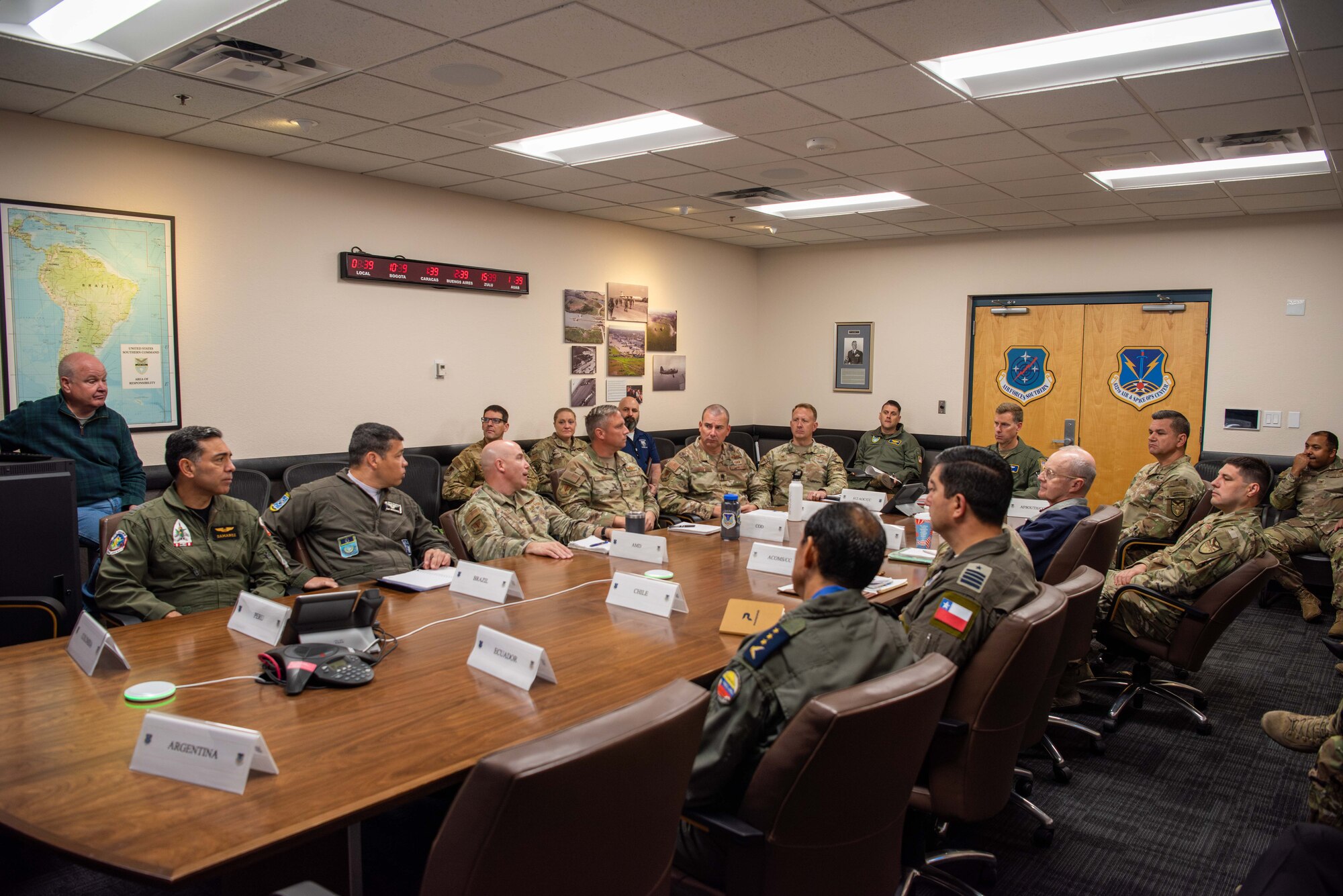 Air Forces Southern Foreign Liaison Officers and 612th Air Operations Center (AOC) staff attend a Combined Forces Air Component Commander update briefing at Davis-Monthan Air Force Base, Arizona, March 5, 2025. The briefing marked phase one for the Liaison Officers from Argentina, Brazil, Chile, Colombia, Ecuador, and Peru, joining U.S. Air Force personnel at the 612th AOC, marking a significant milestone in coalition air power coordination. (U.S. Air Force photo by Master Sgt. Kenneth New)