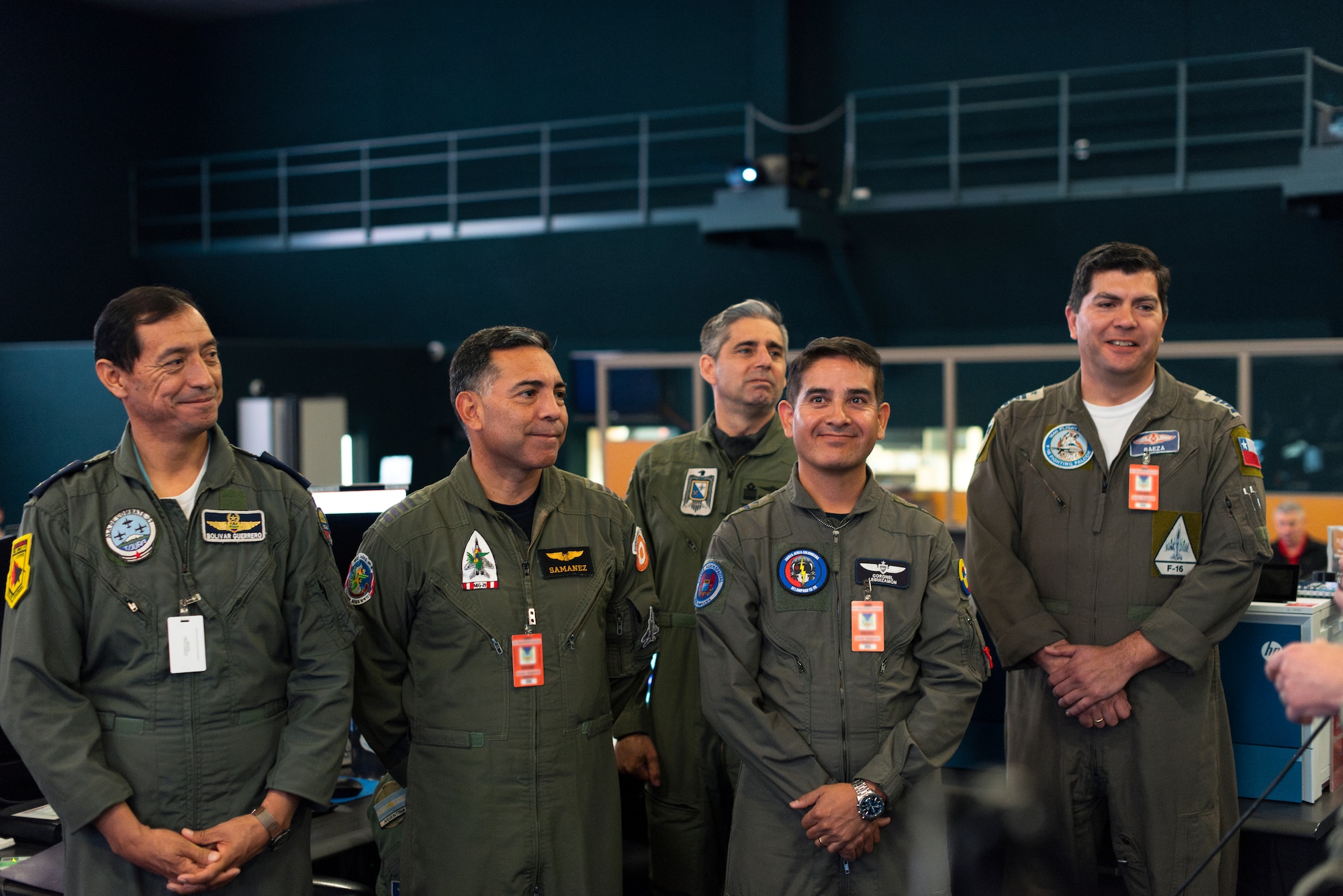 Air Forces Southern Foreign Liaison Officers attend a Combat Operations Division changeover brief at the 612th Air Operations Center (AOC) on Davis-Monthan Air Force Base, Arizona, March 14, 2025. The briefing marked phase two for the Liaison Officers from Argentina, Brazil, Chile, Colombia, Ecuador, and Peru, joining U.S. Air Force personnel at the 612th AOC, marking a significant milestone in coalition air power coordination. (U.S. Air Force photo by Tech. Sgt. Rachel Maxwell)