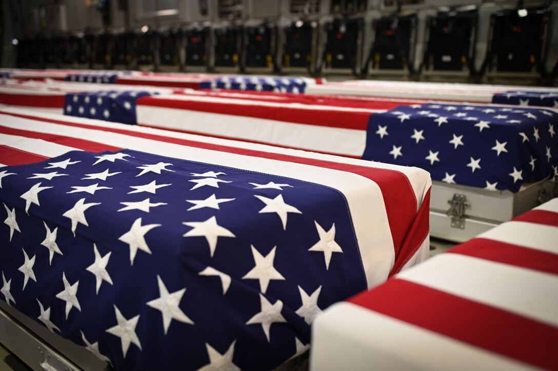 U.S. service members from the Defense POW/MIA Accounting Agency prepare to conduct an honorable carry ceremony at Joint Base Pearl Harbor-Hickam, Hawaii, March 14, 2025.  The 34 sets of unknown remains were previously buried in the Philippines, and they will be examined by forensic anthropologists and odontologists at DPAA’s skeletal identification laboratory. DPAA conducts global search, recovery and laboratory operations to provide the fullest possible accounting for America’s missing personnel to their families and the nation.