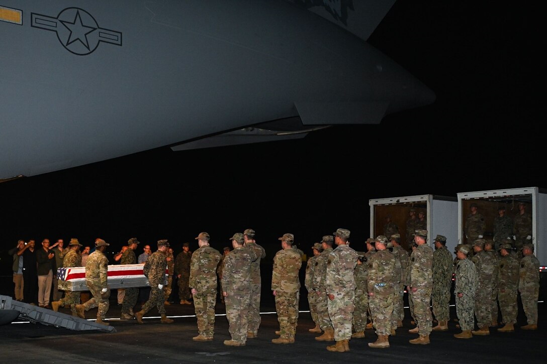 U.S. service members from the Defense POW/MIA Accounting Agency prepare to conduct an honorable carry ceremony at Joint Base Pearl Harbor-Hickam, Hawaii, March 14, 2025.  The 34 sets of unknown remains were previously buried in the Philippines, and they will be examined by forensic anthropologists and odontologists at DPAA’s skeletal identification laboratory. DPAA conducts global search, recovery and laboratory operations to provide the fullest possible accounting for America’s missing personnel to their families and the nation.