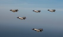 Two U.S. Air Force F-35A Lighting IIs, two ROKAF F-35As and one U.S. Navy F-35C fly in formation during integration training as part of Freedom Shield 25, March 13, 2025.