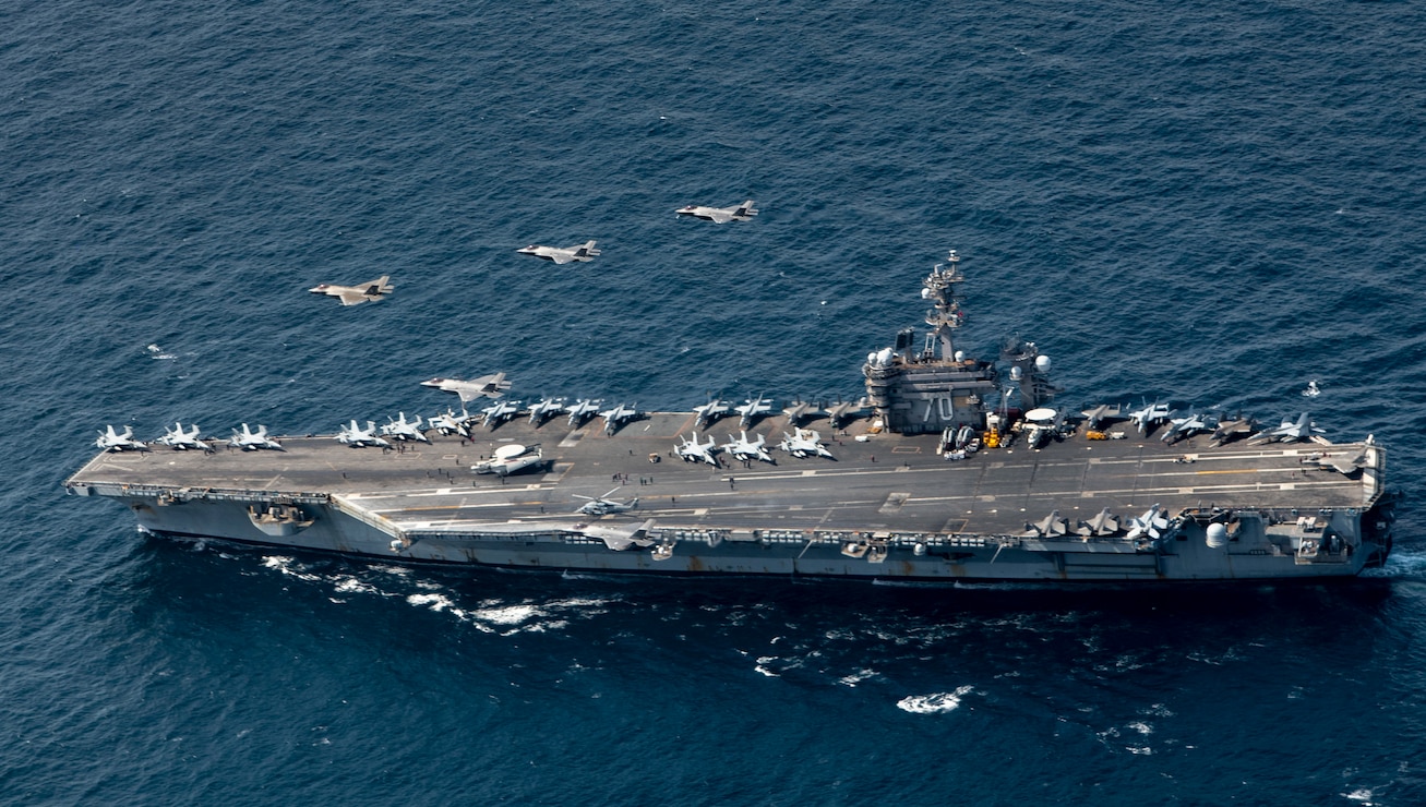 F-35 Lightning IIs from the U.S. Air Force, U.S. Navy, and Republic of Korea Air Force flight in formation over the Nimitz-class aircraft carrier USS Carl Vinson (CVN 70) during integration training for Freedom Shield 25, March 13, 2025.