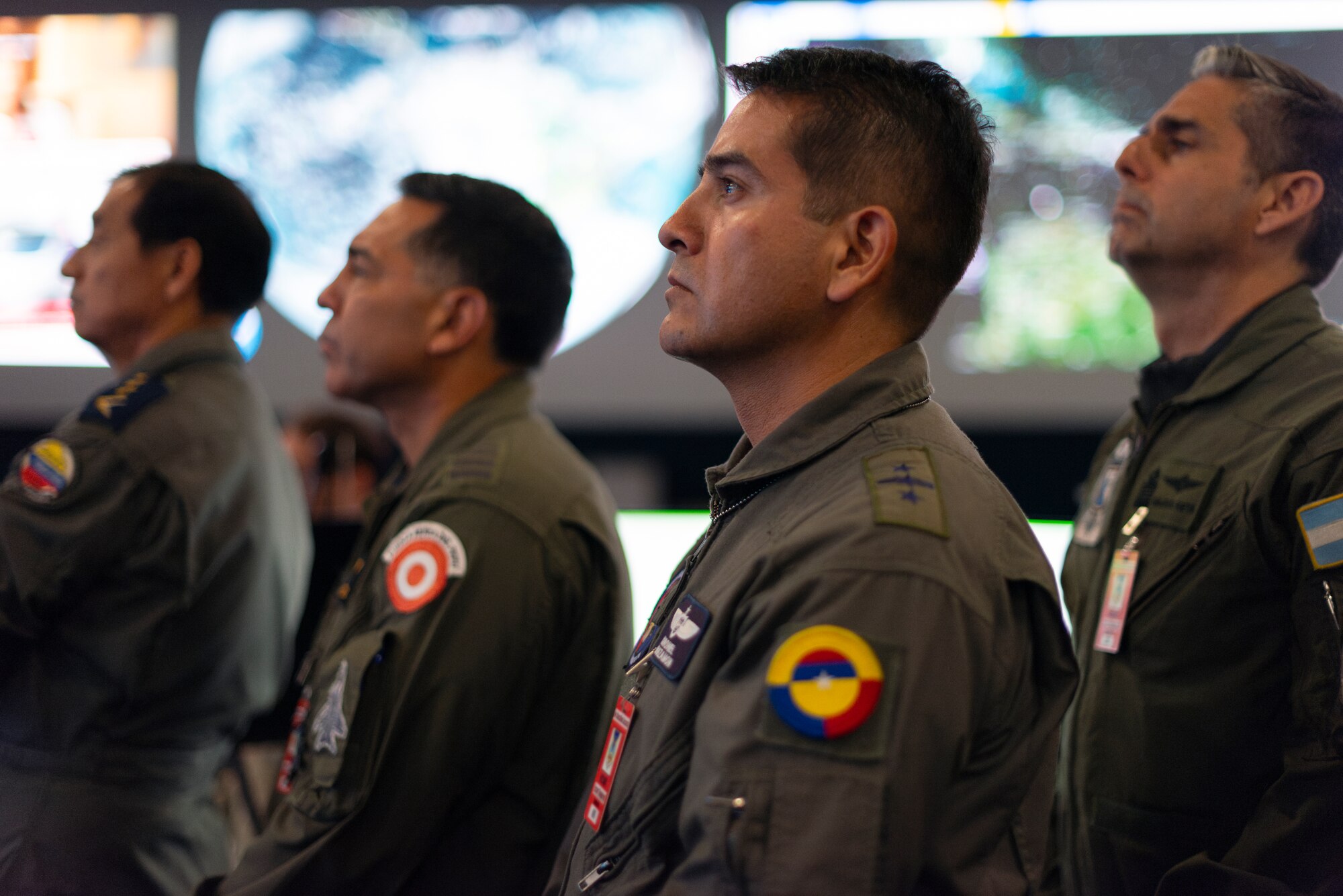 Colombian air force Col. Alejandro Leguizamón listens to a Combat Operations Division changeover brief at the 612th Air Operations Center (AOC) on Davis-Monthan Air Force Base, Arizona, March 14, 2025. The briefing marked phase two for the Liaison Officers from Argentina, Brazil, Chile, Colombia, Ecuador, and Peru, joining U.S. Air Force personnel at the 612th AOC, marking a significant milestone in coalition air power coordination. (U.S. Air Force photo by Tech. Sgt. Rachel Maxwell)