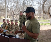Senior Chief, United States Navy (Ret.) Ekali Brooks delivers a speech to the 2025 DoD K-9 Competition participants