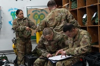 Reserve Citizen Airmen assigned to the 433rd Airlift Wing prepare gear during an aeromedical evacuation exercise onboard Naval Station (NAVSTA) Rota, Spain, March 10, 2025.
