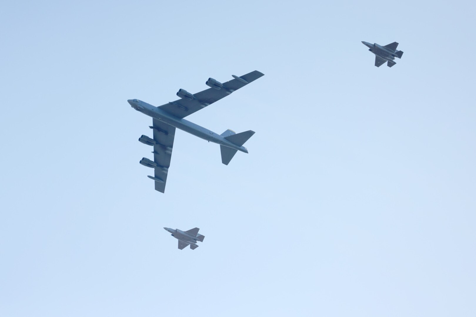 A U.S. Air Force B-52H Stratofortress conducts a low-pass over Oslo, Norway, alongside two Royal Norwegian Air Force F-35 Lightning IIs during Bomber Task Force 25-2 mission TOWER BLOCKHOUSE March 14, 2025. Bomber Task Force missions provide critical opportunities to integrate and train with regional partners. Integration Is a critical component of agile combat employment, allowing U.S. forces to adapt to evolving international security environments with speed and precision.  (Photo courtesy of the Norwegian Armed Forces)