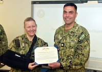 JOINT BASE SAN ANTONIO-FORT SAM HOUSTON – (March 13, 2025) – Lt. Cmdr. Jeffrey Biberston, Medical Corps, of Casper, Wyo., department head, Expeditionary and Trauma Medicine, was awarded the Navy and Marine Corps Achievement Medal by Naval Medical Research Unit (NAMRU) San Antonio Commanding Officer Capt. Jennifer Buechel during an All Hands Meeting held at the Battlefield Health and Trauma Research Institute. Biberston, was recently selected as NAMRU San Antonio’s Junior Officer of the Year for 2024 and is the only Pulmonary and Critical Care physician currently serving within Naval Medicine Research and Development (NMR&D). NAMRU San Antonio is one of eight research laboratories within NMR&D. Its mission is to conduct gap driven combat casualty care, craniofacial, and directed energy research to improve survival, operational readiness, and safety of Department of Defense personnel engaged in routine and expeditionary operations. (U.S. Navy photo by Burrell Parmer, NAMRU San Antonio Public Affairs/Released)
