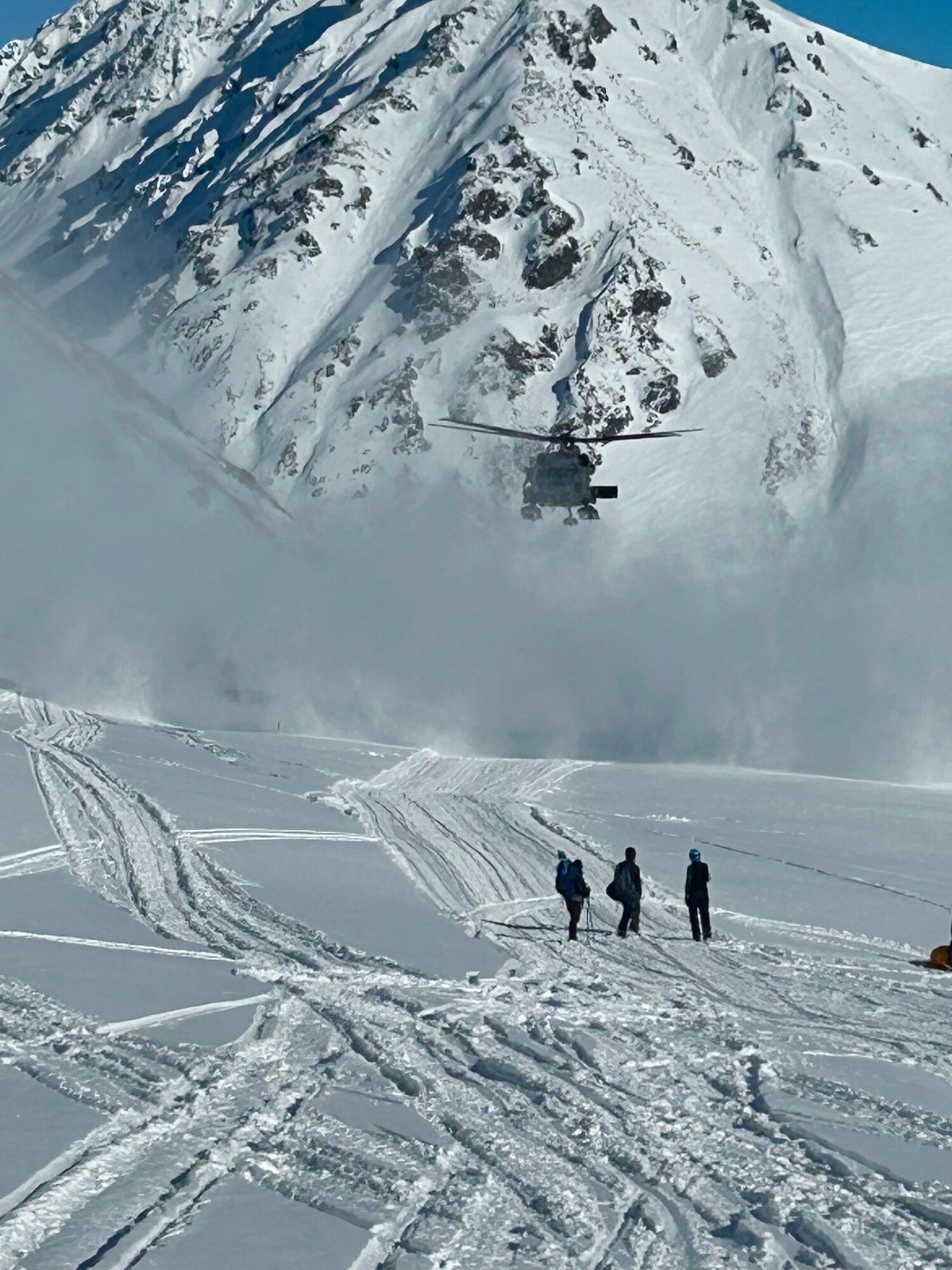 A 210th Rescue Squadron HH-60G Pave Hawk with 212th Rescue Squadron pararescuemen onboard searches for an injured paraglider March 8, 2025, at Hatcher Pass. The rescuers found, treated and transported the patient to Providence Alaska Medical Center in Anchorage.