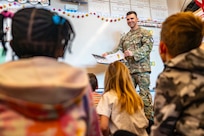 man reads to class